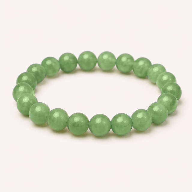 Chunky polished prehnite beaded stretch bracelet with pale green translucency and natural inclusions.