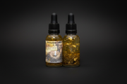 Two bottles of Belladonna Botanicals Protection Oil with dropper lids on a white background.