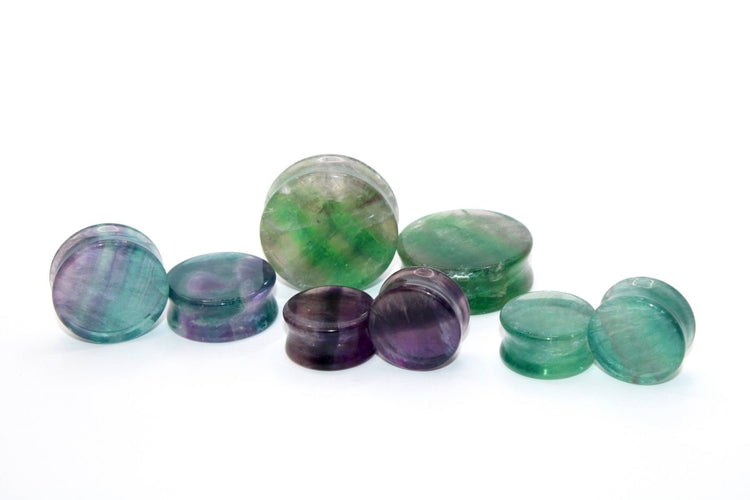 Set of multicolored gemstones on a white background