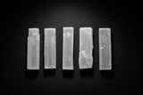 Short raw white satin spar gypsum wand measuring approximately 3 to 4 inches