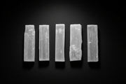 Short raw white satin spar gypsum wand measuring approximately 3 to 4 inches