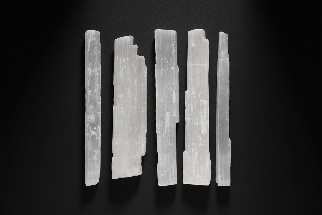 Long raw satin spar gypsum wand commonly sold as selenite, approximately 10 to 13 inches
