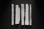 Long raw satin spar gypsum wand commonly sold as selenite, approximately 10 to 13 inches