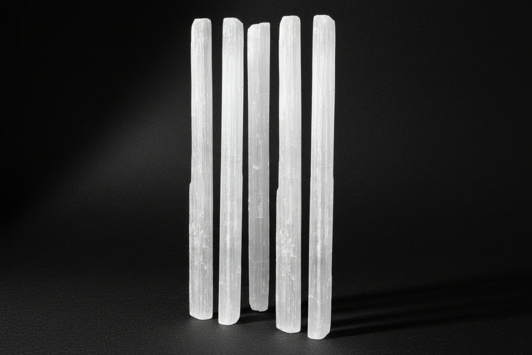 Raw white satin spar gypsum wands measuring approximately 4 to 7 inches