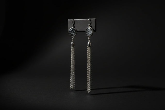 Long chain earrings containing preserved natural spiderweb