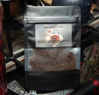 Black coffee bag labeled 'Relationship Ruin Dirt' with a visible brand logo on a metallic surface.