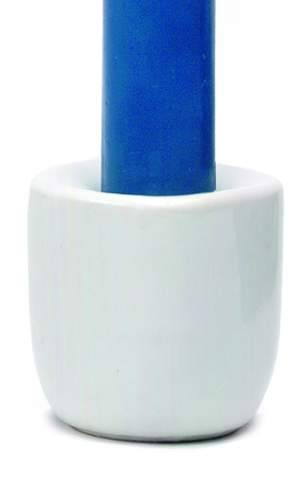 Blue candle in a white ceramic holder on a white background