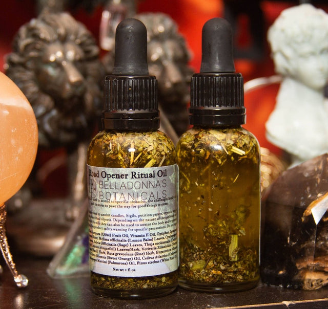 Two bottles of 'Open Opener Ritual Oil' by Belladonna's Botanicals on a mystical background.