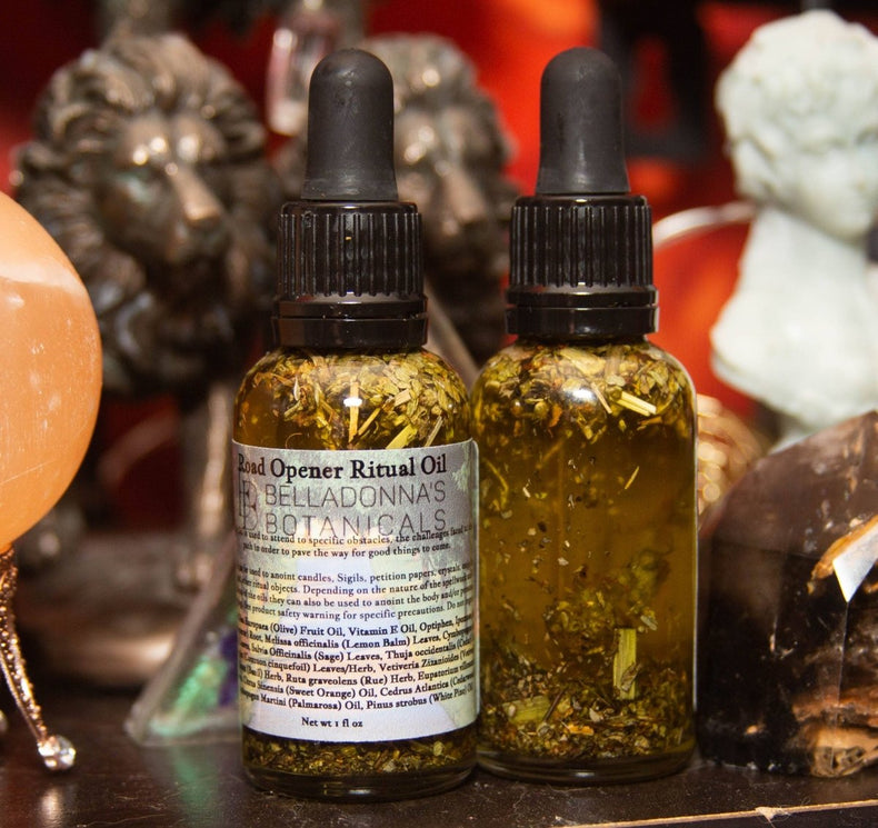 Two bottles of 'Open Opener Ritual Oil' by Belladonna's Botanicals on a mystical background.