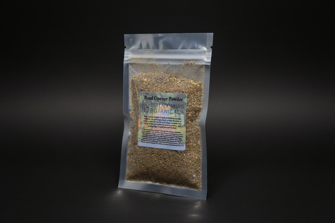 Road Opener Ritual Powder in a labeled package beside a candle