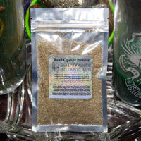 Packaged herb labeled 'Road Opener Powder' by Belladonna's Botanicals on a reflective surface with a candle in the background.