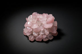 Pink tumbled stones on a white background