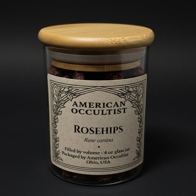 Dried rosehip fruit material (Rosa canina) in a labeled glass ritual herb jar