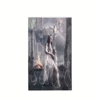 Framed artwork of a woman with antlers in a forest setting