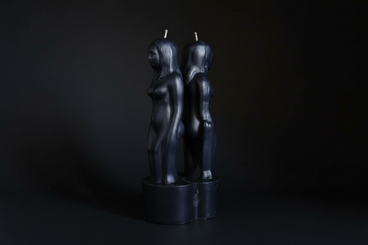 Red separation ritual candle shaped as two joined figures