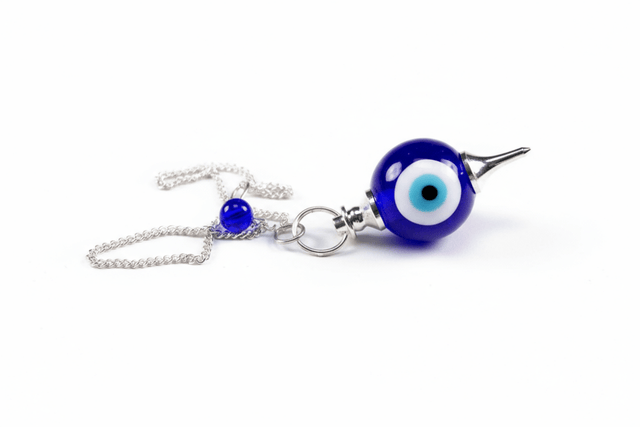 evil eye pendulum on a white background