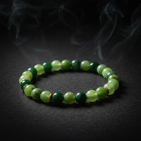 Representative stretch bracelet sold as Chrysoprase with polished green beads; color, translucency, bead size, treatment, and fit vary
