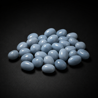 Assortment of small polished pale blue Angelite tumbled stones arranged on a matte black surface