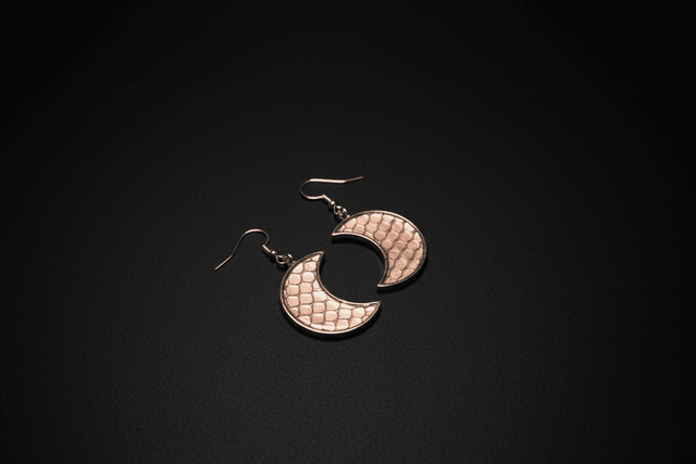 Crescent moon earrings with ethically sourced snake shed
