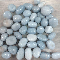 Light blue stones on a wooden surface