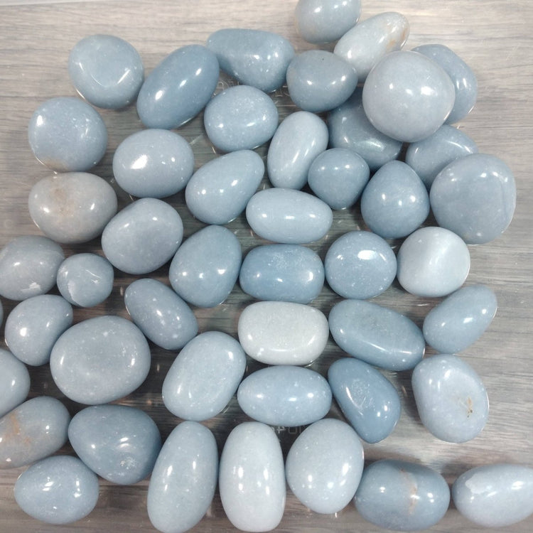 Light blue stones on a wooden surface