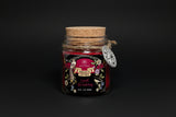 Jar of 'Spell Breaking' ritual powder with decorative label on a white background