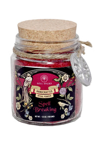 Jar of 'Spell Breaking' ritual powder with decorative label on a white background
