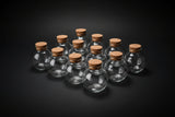 Clear spherical glass bottle with stopper, 3.3 fluid ounces