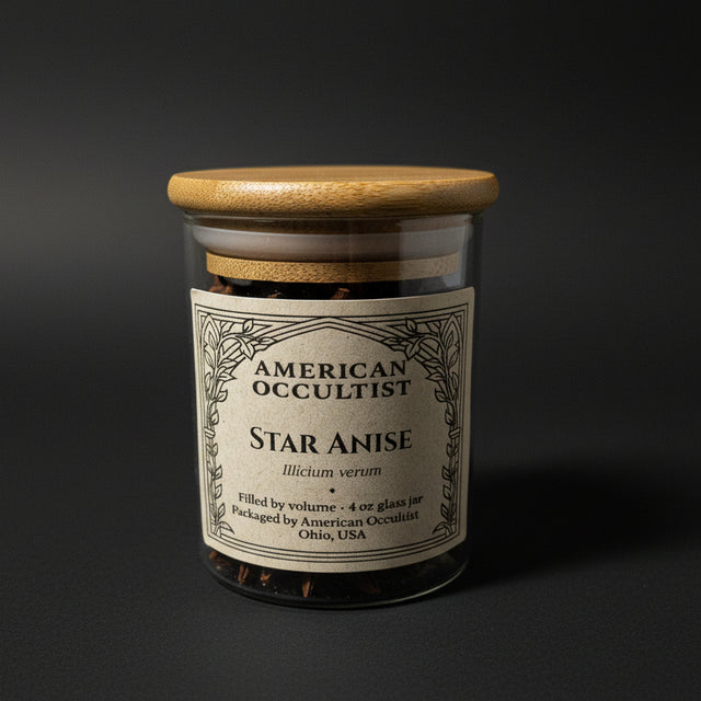 Whole dried star anise fruits (Illicium verum) in a labeled glass ritual herb jar