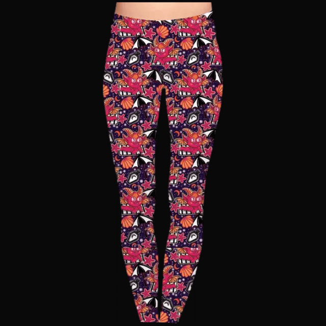 A pair of leggings with a colorful pattern featuring what appears to be celestial and occult motifs, including eyes and abstract shapes.