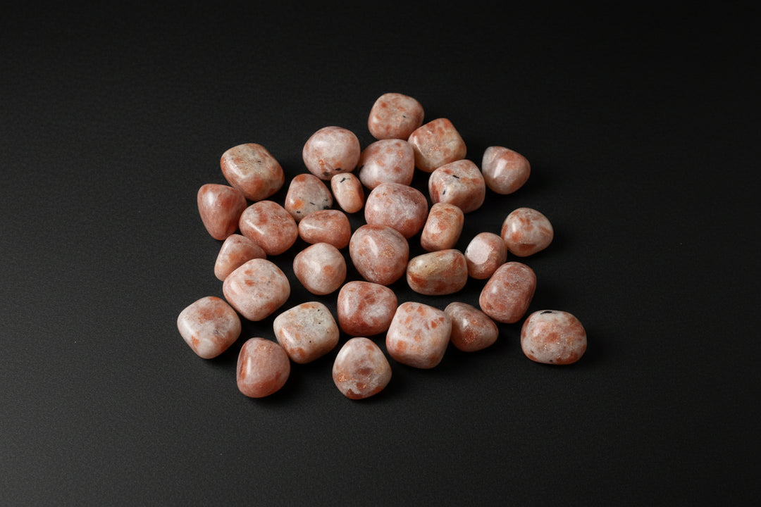 Polished peach-to-orange Sunstone tumbled stones