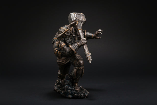 Statue of a warrior holding a hammer on a white background