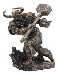 Statue of a dragon-like creature in armor holding a hammer on a white background