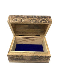 Wooden jewelry box with intricate carvings on a white background