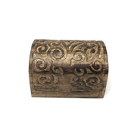 Decorative wooden box with intricate carvings on a white background