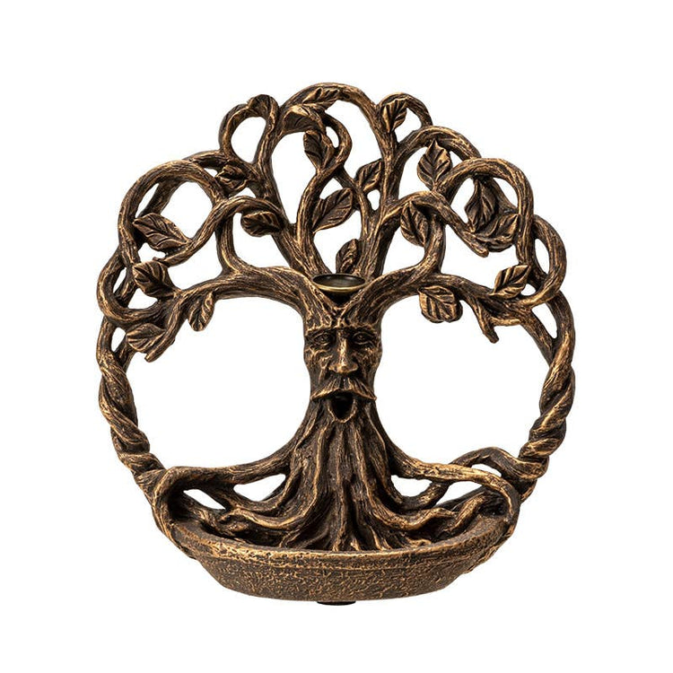Bronze tree-like sculpture with a face on a white background