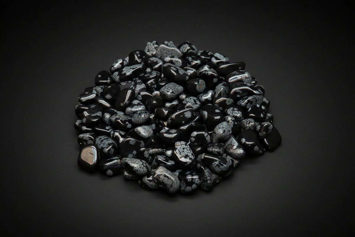 Polished black Snowflake Obsidian stones with white-to-gray patterns