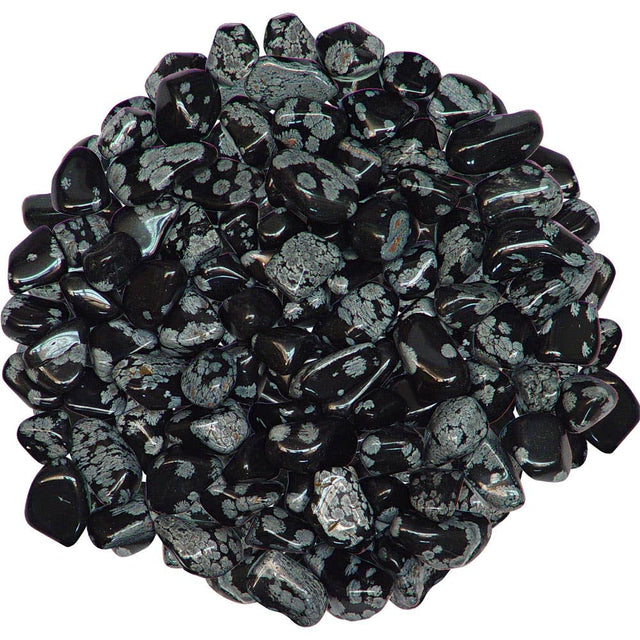Heap of snowflake obsidian black and gray decorative stones on a white background