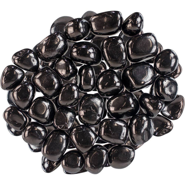 Black pebbles on a white background