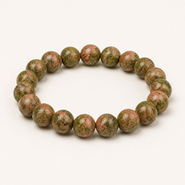 Polished round unakite beaded stretch bracelet with natural olive green and salmon-pink mottling.