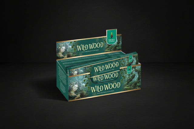 Display of Wild Wood incense sticks packaging with green and gold design.