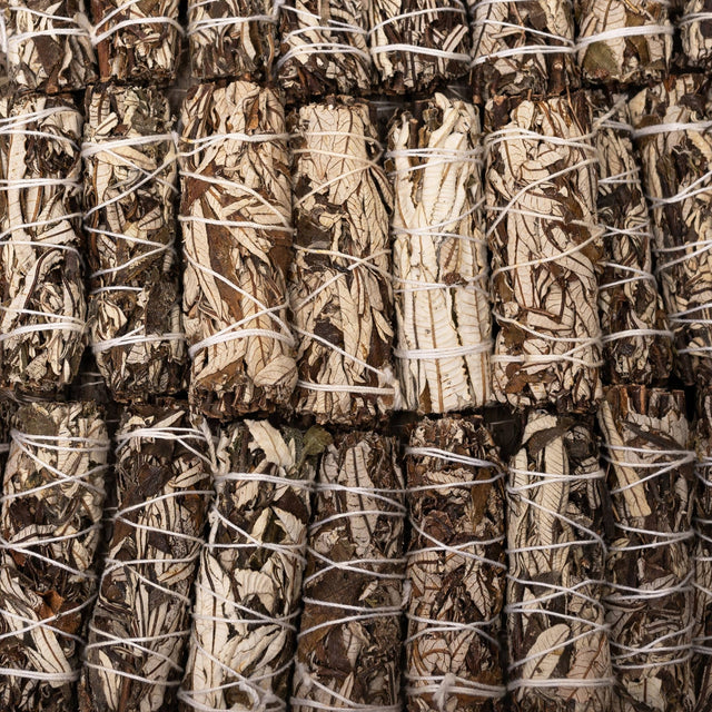 Close-up of bundles of sage tied together with twine.